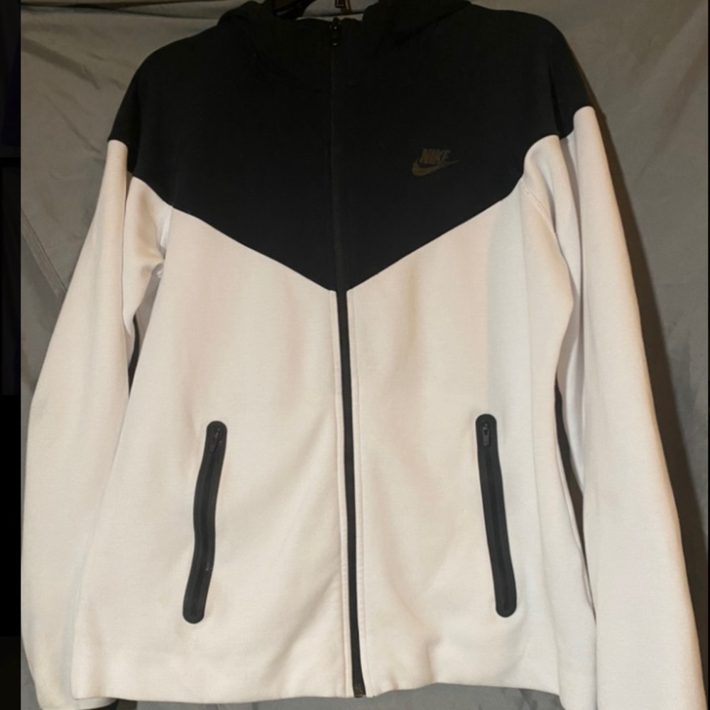 White with black trim Nike Jacket/Hoodie.